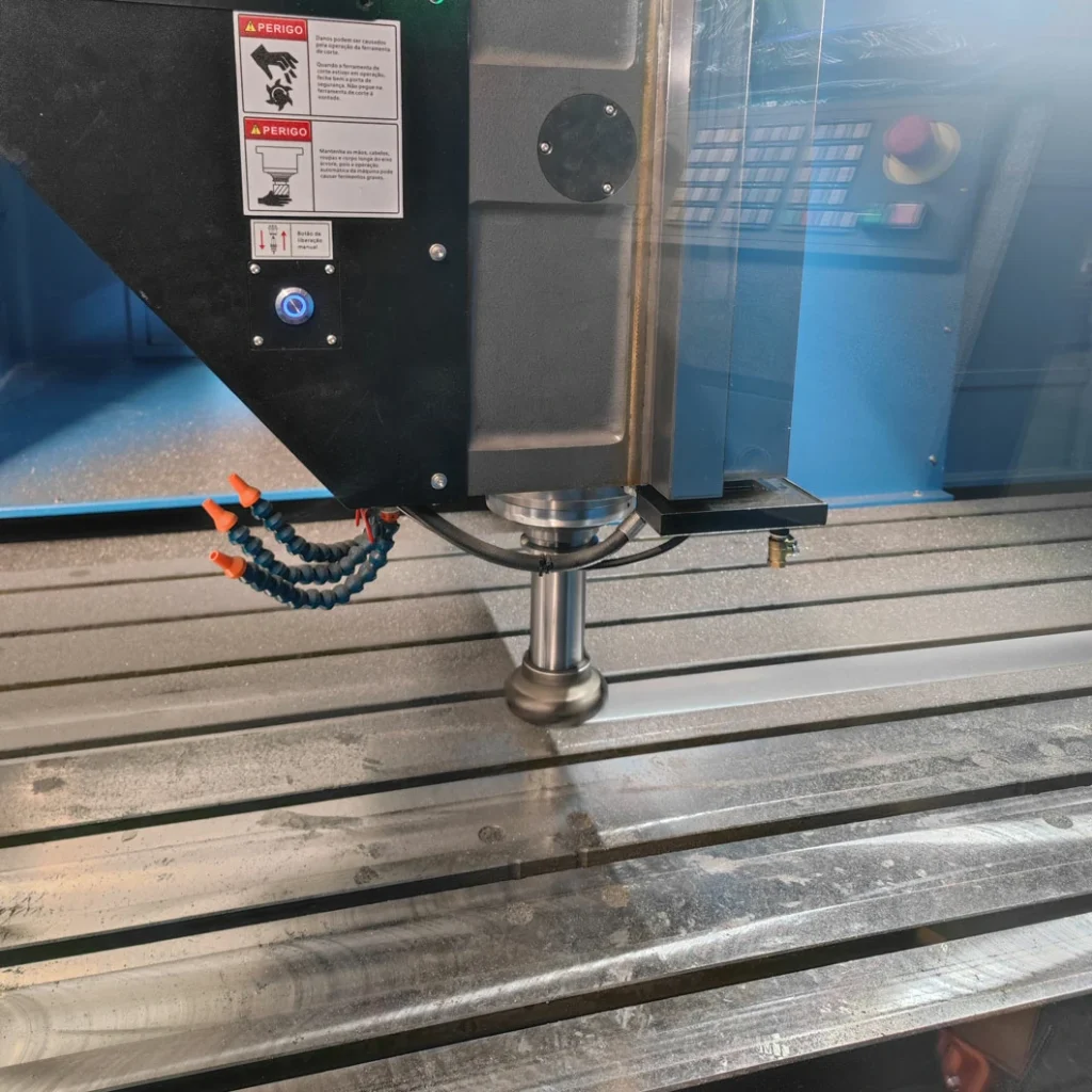 Gantry machining center performing precision milling on metal worktable surface