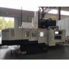 Gantry machining center on factory floor showing precision manufacturing and assembly environment