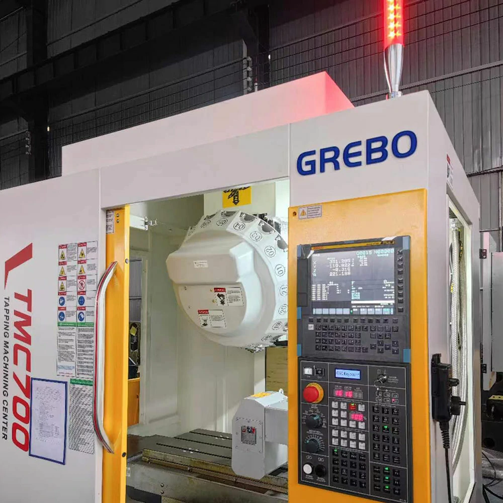 TMC600 Tapping Machining Center showing direct-drive spindle 21-tool ATC and compact frame for high-speed small-part machining